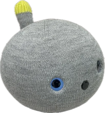 NICOBO。灰色のニットに包まれた丸いロボット